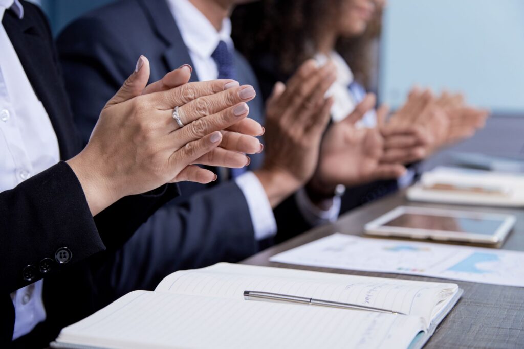crop colleagues clapping on meeting 2023 11 27 05 22 20 utc